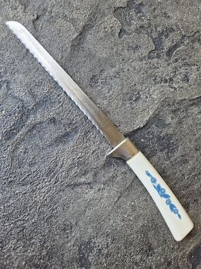 Cornflower Blue Lifetime Cutlery Serrated Table Knife with White Floral Handle